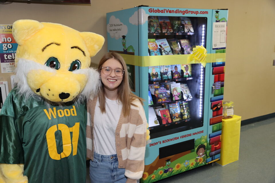 book vending machine - blog Courtney Brecheen with book vending machine she donated to Wood Elementary